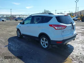 2014 Ford Escape SE with VIN 1FMCU0GX6EUA20379, listed as a IAAI auction lot 42082363 with 129,059 mi miles. Bid and sale history available at carsss.com. Image 3.