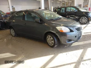 2010 Toyota Yaris with VIN JTDBT4K38A1355010, listed as a IAAI auction lot 41563391 with 154,835 mi miles. Bid and sale history available at carsss.com. Image 1.