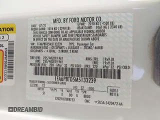 2021 Ford Mustang EcoBoost z VIN 1FA6P8TD5M5133239, wystawiony jako IAAI lot #41899042 z przebiegiem 65 553 mil mil oraz . Historia ofert i sprzedaży dostępna na DreamBid. Obrazek 9.