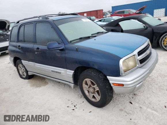 2002 Chevrolet Tracker LT with VIN 2CNBE634126928532, listed as a Copart auction lot 76990704 with Not provided miles and Salvage title. Bid and sale history available at DreamBid. Image 4.