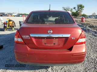 2010 Nissan Versa S with VIN 3N1BC1AP6AL443004, listed as a Copart auction lot 52010495 with 118,801 mi miles and Non Repairable. Bid and sale history available at DreamBid. Image 6.
