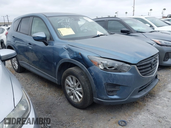 2016 Mazda CX-5 Touring z VIN JM3KE2CY2G0699138, wystawiony jako IAAI lot #42153228 z przebiegiem 144 191 mil mil oraz . Historia ofert i sprzedaży dostępna na DreamBid. Obrazek 1.