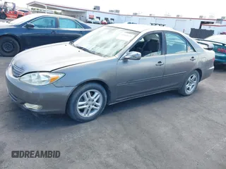2003 Toyota Camry LE with VIN JTDBE32K130149032, listed as a IAAI auction lot 42063174 with 241,424 mi miles and . Bid and sale history available at DreamBid. Image 2.