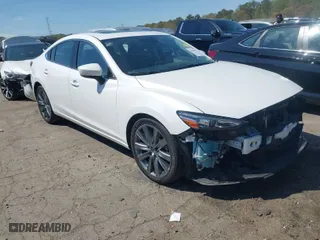 2019 Mazda Mazda6 Touring with VIN JM1GL1VMXK1506052, listed as a IAAI auction lot 41810921 with 60,557 mi miles. Bid and sale history available at carsss.com. Image 1.