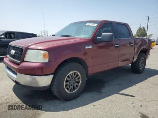 2005 Ford F-150 XLT with VIN 1FTPW125X5KF09293, listed as a Copart auction lot 60921515 with 154,521 mi miles and Salvage title. Bid and sale history available at DreamBid. Image 1.