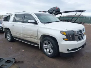 2016 Chevrolet Suburban LTZ with VIN 1GNSKJKC9GR301637, listed as a IAAI auction lot 41585598 with 142,246 mi miles. Bid and sale history available at carsss.com. Image 1.