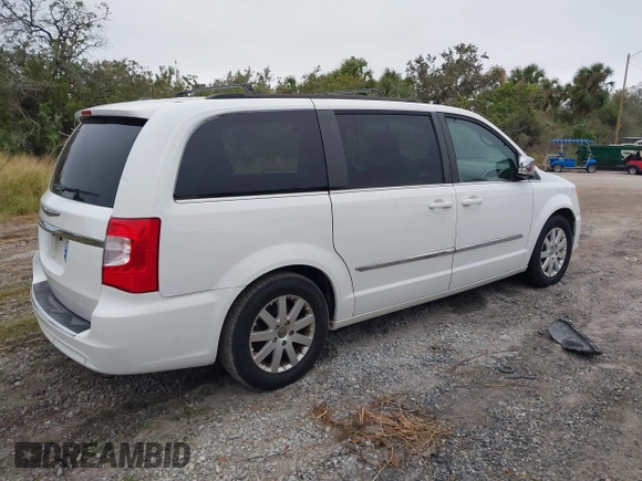 2014 Chrysler Town & Country Touring-L with VIN 2C4RC1CG7ER460427, listed as a IAAI auction lot 40876176 with 177,707 mi miles. Bid and sale history available at carsss.com. Image 4.