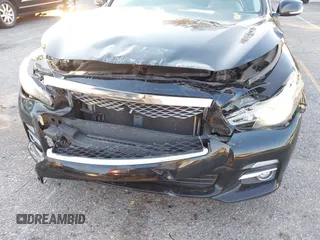 2015 Infiniti Q50 Premium z VIN JN1BV7AP5FM346323, wystawiony jako IAAI lot #41305093 z przebiegiem 112 556 mil mil oraz . Historia ofert i sprzedaży dostępna na DreamBid. Obrazek 6.