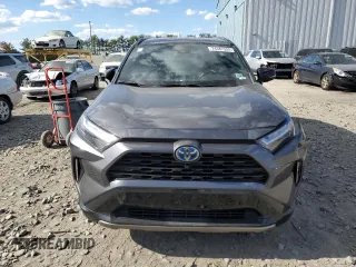 2023 Toyota RAV4 Hybrid XSE with VIN 4T3E6RFV1PU112579, listed as a Copart auction lot 74387924 with 103,340 mi miles and Salvage title. Bid and sale history available at DreamBid. Image 5.