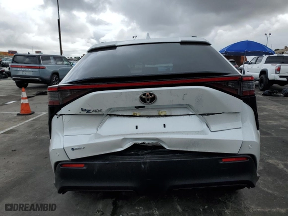 2025 Toyota bZ4X XLE with VIN JTMAAAAA0SA055818, listed as a Copart auction lot 48930285 with 735 mi miles and Salvage Title. Bid and sale history available at carsss.com. Image 6.