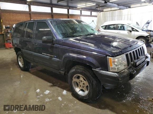 1997 Jeep Grand Cherokee Laredo with VIN 1J4GZ58Y7VC678708, listed as a Copart auction lot 87803725 with 312,585 mi miles and Salvage Title. Bid and sale history available at carsss.com. Image 4.