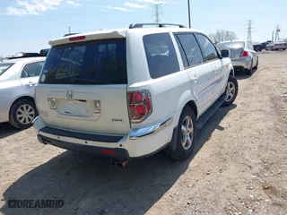 2007 Honda Pilot EX-L with VIN 5FNYF18567B032406, listed as a IAAI auction lot 42120219 with 205,687 mi miles. Bid and sale history available at carsss.com. Image 4.
