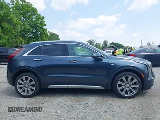 2019 Cadillac XT4 FWD Premium Luxury z VIN 1GYFZCR43KF143980, wystawiony jako IAAI lot #42472400 z przebiegiem 36 496 mil mil oraz . Historia ofert i sprzedaży dostępna na DreamBid. Obrazek 13.