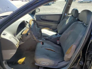 2000 Nissan Maxima GXE z VIN JN1CA31D6YT762114, wystawiony jako Copart lot #57908775 z przebiegiem 207 805 mil mil oraz Szkody całkowita. Historia ofert i sprzedaży dostępna na DreamBid. Obrazek 7.