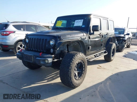 2015 Jeep Wrangler Unlimited Rubicon Hard Rock with VIN 1C4HJWFG7FL602344, listed as a IAAI auction lot 42011914 with 109,238 mi miles and . Bid and sale history available at DreamBid. Image 2.