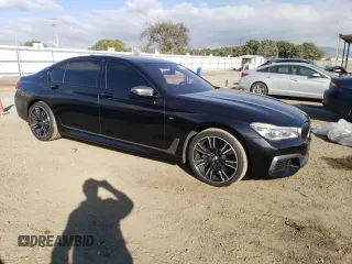 2018 BMW 7 Series M760i xDrive with VIN WBA7H6C50JG614781, listed as a Copart auction lot 83689234 with 49,873 mi miles and Salvage Title. Bid and sale history available at carsss.com. Image 4.