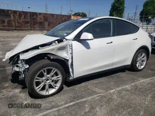 2022 Tesla Model Y Long Range z VIN 7SAYGDEE4NF315356, wystawiony jako Copart lot #57292595 z przebiegiem 1 056 mil mil oraz Szkoda całkowita • Salvage title. Historia ofert i sprzedaży dostępna na DreamBid. Obrazek 1.