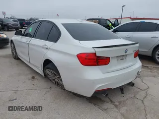 2013 BMW 3 Series 335i with VIN WBA3A9C50DF477209, listed as a IAAI auction lot 41595369 with 99,241 mi miles. Bid and sale history available at carsss.com. Image 3.