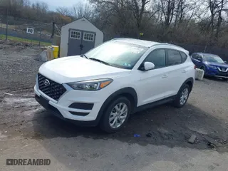 2019 Hyundai Tucson Value with VIN KM8J3CA42KU013032, listed as a IAAI auction lot 41880465 with 51,332 mi miles. Bid and sale history available at carsss.com. Image 2.