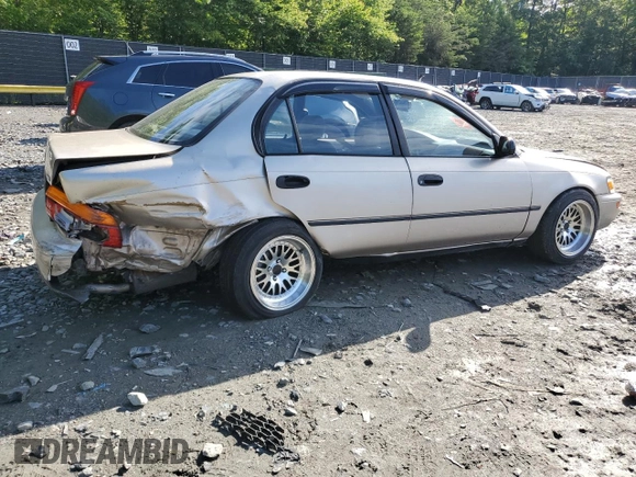 1995 Toyota Corolla DX with VIN 2T1AE09B0SC098739, listed as a Copart auction lot 57653205 with 154,226 mi miles and Salvage title. Bid and sale history available at DreamBid. Image 3.
