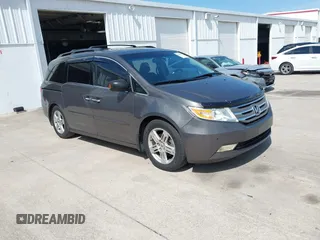 2011 Honda Odyssey Touring with VIN 5FNRL5H9XBB006424, listed as a IAAI auction lot 41982951 with 281,839 mi miles and . Bid and sale history available at DreamBid. Image 1.