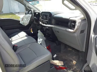 2023 Ford F-150 XL with VIN 1FTMF1CP7PKF84555, listed as a IAAI auction lot 42197597 with 12,216 mi miles and . Bid and sale history available at DreamBid. Image 5.