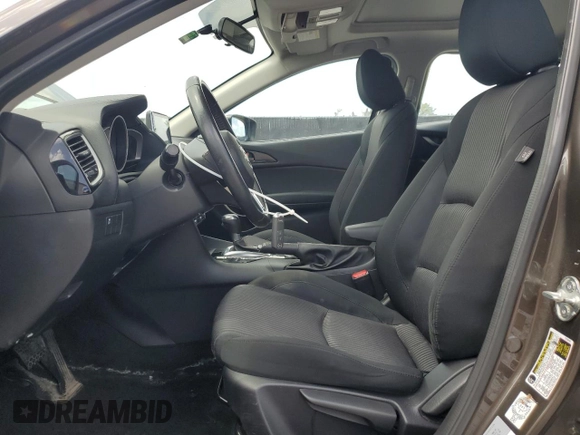 2014 Mazda 3 i Touring with VIN JM1BM1L71E1181056, listed as a Copart auction lot 59767705 with 129,447 mi miles and Salvage title. Bid and sale history available at DreamBid. Image 7.