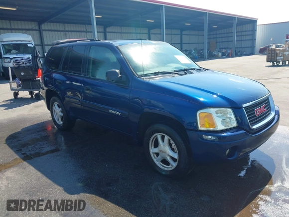 2004 GMC Envoy SLE with VIN 1GKDT13S242391968, listed as a IAAI auction lot 42079420 with 234,611 mi miles. Bid and sale history available at carsss.com. Image 1.