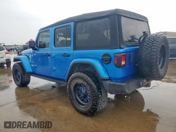 2023 Jeep Wrangler Sahara with VIN 1C4HJXEG7PW590252, listed as a Copart auction lot 59377765 with 32,689 mi miles and Salvage title. Bid and sale history available at DreamBid. Image 2.