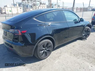 2025 Tesla Model Y Long Range with VIN 7SAYGDEE9SF278607, listed as a IAAI auction lot 41932084 with 9,667 mi miles and . Bid and sale history available at carsss.com. Image 4.