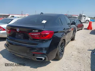 2018 BMW X6 xDrive50i with VIN 5UXKU6C58J0W39038, listed as a IAAI auction lot 40025654 with 106,080 mi miles. Bid and sale history available at carsss.com. Image 4.