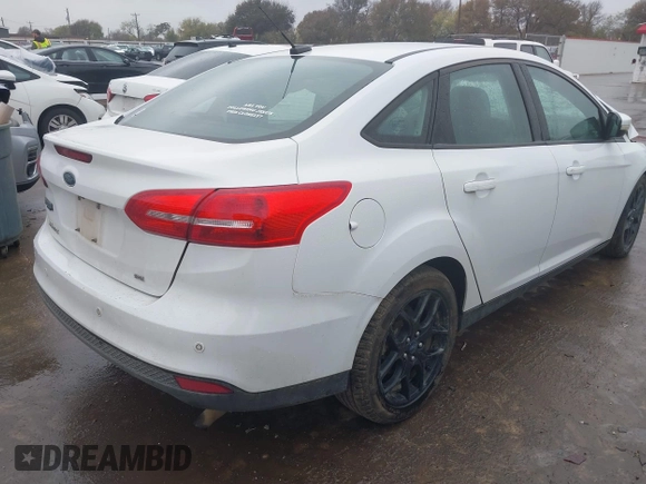 2016 Ford Focus SE z VIN 1FADP3F27GL326593, wystawiony jako IAAI lot #41024761 z przebiegiem 131 200 mil mil oraz . Historia ofert i sprzedaży dostępna na DreamBid. Obrazek 4.