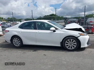 2019 Toyota Camry LE z VIN 4T1B11HKXKU237605, wystawiony jako IAAI lot #42248386 z przebiegiem 70 235 mil mil oraz . Historia ofert i sprzedaży dostępna na DreamBid. Obrazek 13.