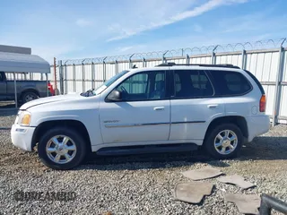 2006 GMC Envoy SLT with VIN 1GKDS13S062128531, listed as a IAAI auction lot 41458983 with 119,385 mi miles. Bid and sale history available at carsss.com. Image 14.