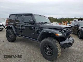 2023 Jeep Wrangler Sport with VIN 1C4HJXDG8PW643414, listed as a Copart auction lot 87768255 with 31,894 mi miles and Salvage Title. Bid and sale history available at DreamBid. Image 4.