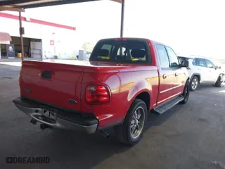 2001 Ford F-150 SuperCrew XLT with VIN 1FTRW07W61KB16745, listed as a IAAI auction lot 42001221 with 260,200 mi miles. Bid and sale history available at carsss.com. Image 4.