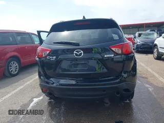 2013 Mazda CX-5 Grand Touring with VIN JM3KE4DE6D0148030, listed as a IAAI auction lot 42082947 with 119,432 mi miles and . Bid and sale history available at DreamBid. Image 16.