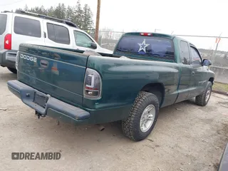 2000 Dodge Dakota Sport with VIN 1B7GL22N6YS764185, listed as a IAAI auction lot 41570275 with 157,334 mi miles. Bid and sale history available at carsss.com. Image 4.