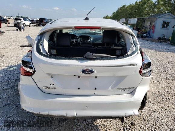 2014 Ford Focus Titanium z VIN 1FADP3N27EL161613, wystawiony jako Copart lot #56166805 z przebiegiem 140 336 mil mil oraz Szkoda całkowita • Salvage title. Historia ofert i sprzedaży dostępna na DreamBid. Obrazek 6.