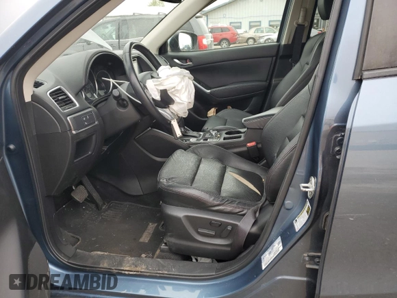 2016 Mazda CX-5 Grand Touring with VIN JM3KE2DY0G0748190, listed as a Copart auction lot 51913155 with 107,997 mi miles and Salvage Title. Bid and sale history available at carsss.com. Image 7.