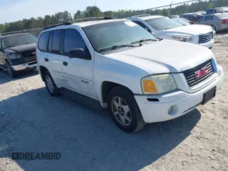 2003 GMC Envoy SLT with VIN 1GKDS13S832300090, listed as a IAAI auction lot 41993627 with 210,631 mi miles. Bid and sale history available at carsss.com. Image 1.