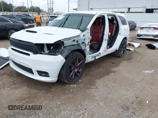 2018 Dodge Durango SRT with VIN 1C4SDJGJ4JC341550, listed as a IAAI auction lot 41525295 with 86,503 mi miles and . Bid and sale history available at DreamBid. Image 2.