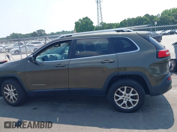 2015 Jeep Cherokee Latitude z VIN 1C4PJMCS9FW551694, wystawiony jako IAAI lot #42424992 z przebiegiem 125 852 mil mil oraz . Historia ofert i sprzedaży dostępna na DreamBid. Obrazek 14.