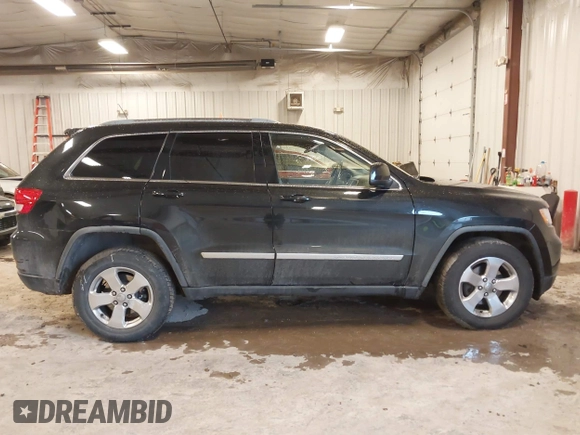 2012 Jeep Grand Cherokee Laredo with VIN 1C4RJFAT1CC225479, listed as a IAAI auction lot 41709911 with 227,150 mi miles. Bid and sale history available at carsss.com. Image 13.