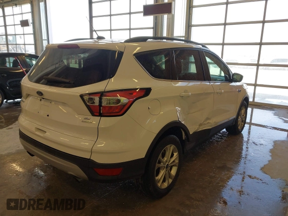 2017 Ford Escape SE z VIN 1FMCU0GD3HUC12658, wystawiony jako IAAI lot #41801033 z przebiegiem 107 662 mil mil oraz . Historia ofert i sprzedaży dostępna na DreamBid. Obrazek 4.