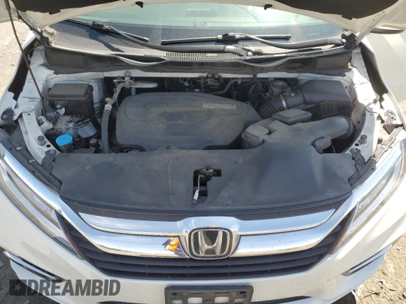 2018 Honda Odyssey Touring with VIN 5FNRL6H8XJB018438, listed as a Copart auction lot 61876505 with 104,581 mi miles and Salvage title. Bid and sale history available at DreamBid. Image 12.
