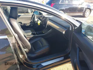 2018 Tesla Model 3 Long Range Battery with VIN 5YJ3E1EA2JF014975, listed as a IAAI auction lot 41319407 with 106,301 mi miles and . Bid and sale history available at DreamBid. Image 5.