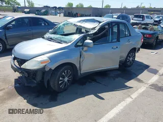 2009 Nissan Versa 1.8 S with VIN 3N1BC11E09L449780, listed as a IAAI auction lot 42034977 with 180,680 mi miles. Bid and sale history available at carsss.com. Image 2.