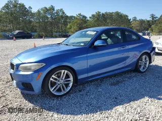 2015 BMW 2 Series 228i with VIN WBA1F5C50FV256672, listed as a Copart auction lot 50062235 with 120,213 mi miles and Salvage Title. Bid and sale history available at carsss.com. Image 1.