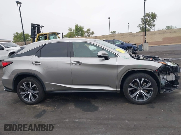 2022 Lexus RX 450h with VIN 2T2HGMDA7NC072735, listed as a IAAI auction lot 42356852 with 62,835 mi miles and . Bid and sale history available at DreamBid. Image 14.